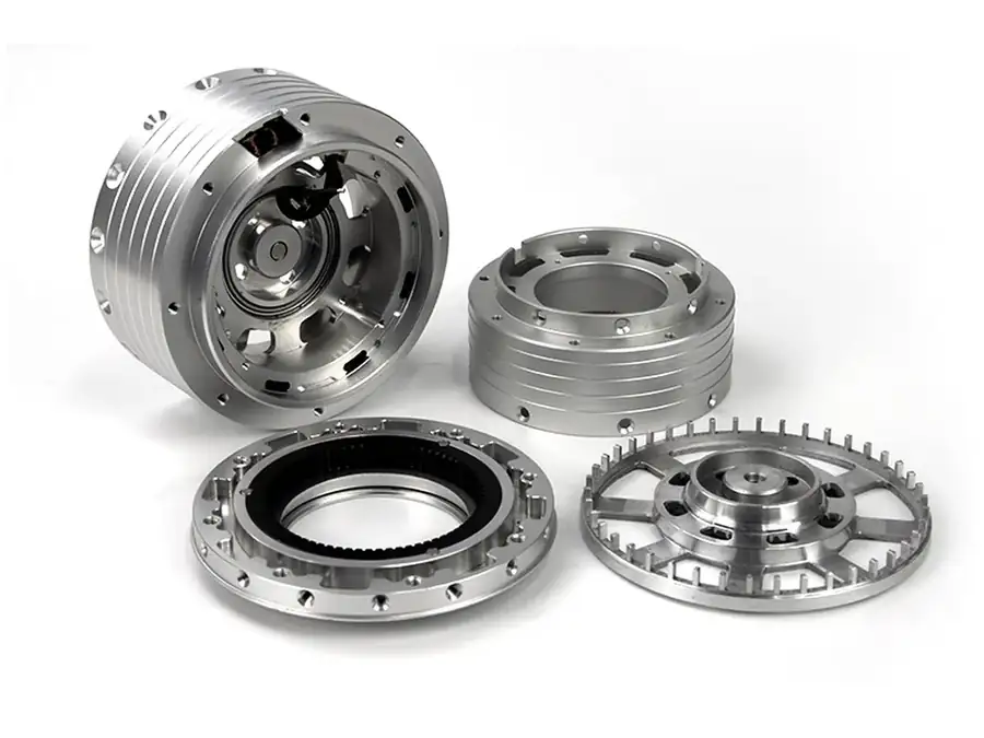 Set of machined aluminium housings, rings and a slotted disc for a rotary assembly