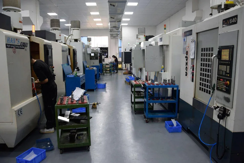 Machinist at a vertical machining center in the milling bay